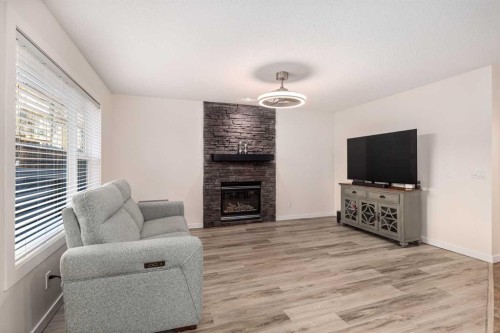 38 Evansbrooke Manor Nw, Calgary, AB - Indoor Photo Showing Living Room With Fireplace