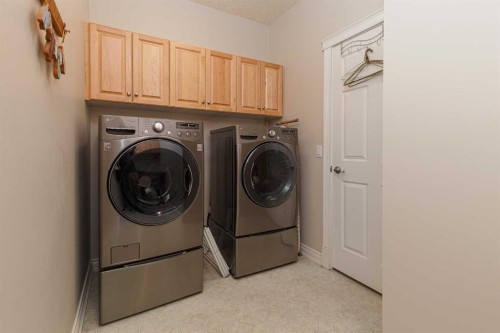 53 Prominence Path Sw, Calgary, AB - Indoor Photo Showing Laundry Room