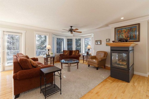 53 Prominence Path Sw, Calgary, AB - Indoor Photo Showing Living Room With Fireplace