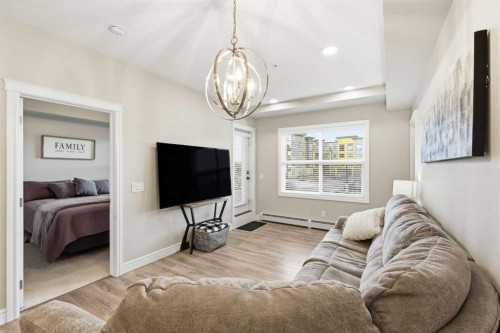 203-19661 40 Street Se, Calgary, AB - Indoor Photo Showing Living Room