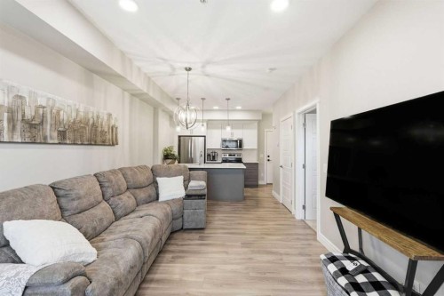 203-19661 40 Street Se, Calgary, AB - Indoor Photo Showing Living Room