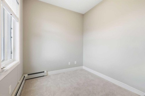 203-19661 40 Street Se, Calgary, AB - Indoor Photo Showing Other Room