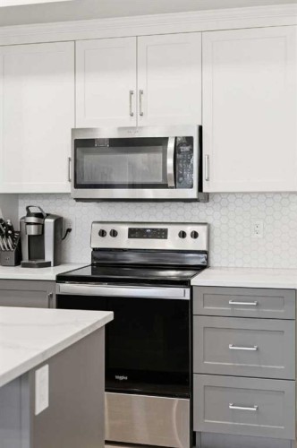 203-19661 40 Street Se, Calgary, AB - Indoor Photo Showing Kitchen With Upgraded Kitchen