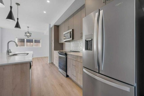 64 Creekside Boulevard Sw, Calgary, AB - Indoor Photo Showing Kitchen With Upgraded Kitchen