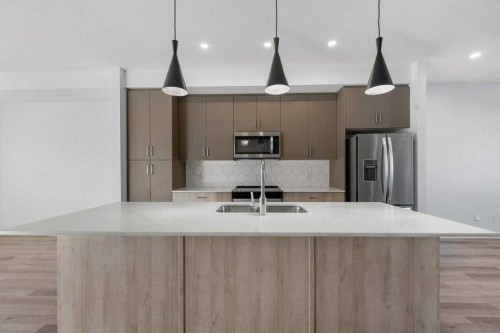 64 Creekside Boulevard Sw, Calgary, AB - Indoor Photo Showing Kitchen With Upgraded Kitchen
