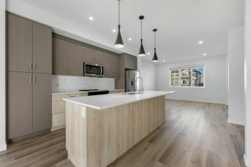 64 Creekside Boulevard Sw, Calgary, AB - Indoor Photo Showing Kitchen With Upgraded Kitchen