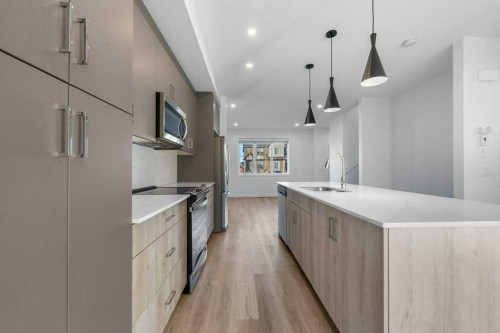 64 Creekside Boulevard Sw, Calgary, AB - Indoor Photo Showing Kitchen With Upgraded Kitchen