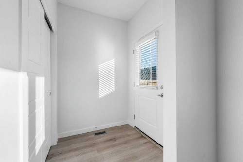 64 Creekside Boulevard Sw, Calgary, AB - Indoor Photo Showing Other Room