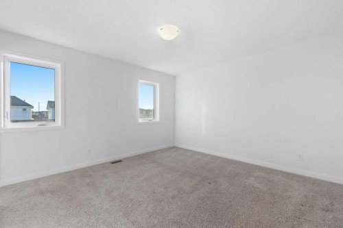 64 Creekside Boulevard Sw, Calgary, AB - Indoor Photo Showing Other Room