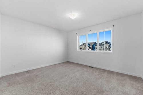 64 Creekside Boulevard Sw, Calgary, AB - Indoor Photo Showing Other Room