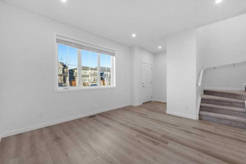 64 Creekside Boulevard Sw, Calgary, AB - Indoor Photo Showing Other Room