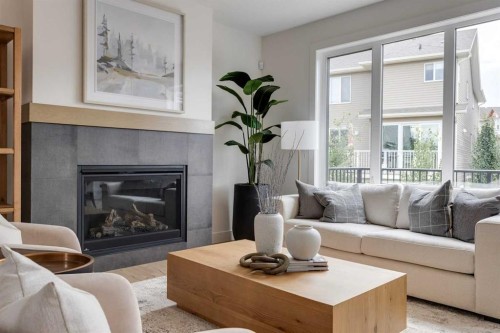 46 Heritage Close, Cochrane, AB - Indoor Photo Showing Living Room With Fireplace