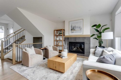46 Heritage Close, Cochrane, AB - Indoor Photo Showing Living Room With Fireplace