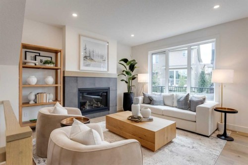 46 Heritage Close, Cochrane, AB - Indoor Photo Showing Living Room With Fireplace