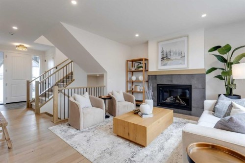 46 Heritage Close, Cochrane, AB - Indoor Photo Showing Living Room With Fireplace