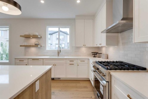 46 Heritage Close, Cochrane, AB - Indoor Photo Showing Kitchen With Upgraded Kitchen