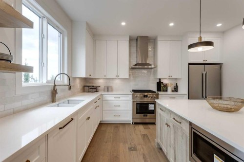 46 Heritage Close, Cochrane, AB - Indoor Photo Showing Kitchen With Upgraded Kitchen