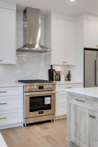 46 Heritage Close, Cochrane, AB - Indoor Photo Showing Kitchen With Upgraded Kitchen