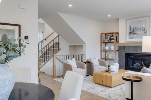46 Heritage Close, Cochrane, AB - Indoor Photo Showing Living Room With Fireplace