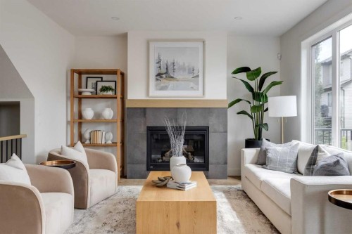 46 Heritage Close, Cochrane, AB - Indoor Photo Showing Living Room With Fireplace