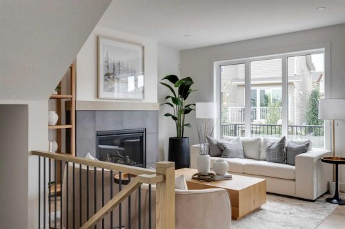 46 Heritage Close, Cochrane, AB - Indoor Photo Showing Living Room With Fireplace
