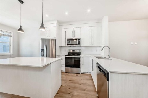 301-50 Cornerstone Passage, Calgary, AB - Indoor Photo Showing Kitchen With Stainless Steel Kitchen With Double Sink With Upgraded Kitchen