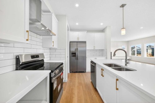 1642 Baywater Street Sw, Airdrie, AB - Indoor Photo Showing Kitchen With Stainless Steel Kitchen With Double Sink With Upgraded Kitchen
