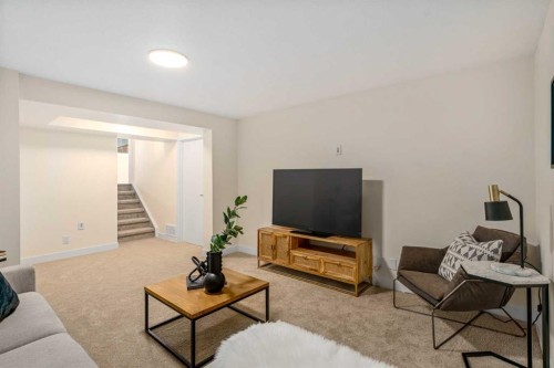 204 Mckerrell Way Se, Calgary, AB - Indoor Photo Showing Living Room