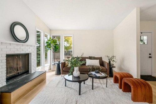 204 Mckerrell Way Se, Calgary, AB - Indoor Photo Showing Living Room With Fireplace