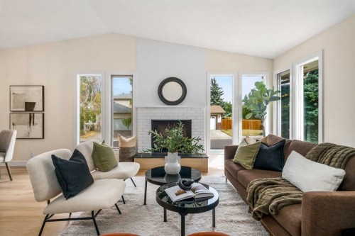 204 Mckerrell Way Se, Calgary, AB - Indoor Photo Showing Living Room With Fireplace