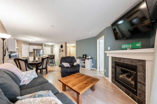 117-260 Shawville Way Se, Calgary, AB - Indoor Photo Showing Living Room With Fireplace