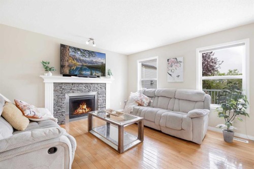 130 Morningside Point Sw, Airdrie, AB - Indoor Photo Showing Living Room With Fireplace