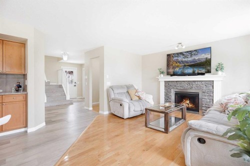 130 Morningside Point Sw, Airdrie, AB - Indoor Photo Showing Living Room With Fireplace
