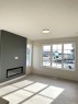 220 Waterford Heath, Chestermere, AB  - Indoor Photo Showing Living Room With Fireplace 