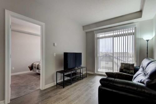 324-117 Copperpond Common Se, Calgary, AB - Indoor Photo Showing Living Room