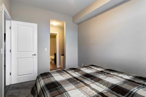 324-117 Copperpond Common Se, Calgary, AB - Indoor Photo Showing Bedroom