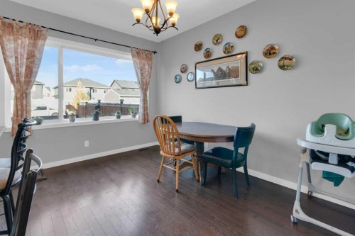 82 Fireside Cove, Cochrane, AB - Indoor Photo Showing Dining Room