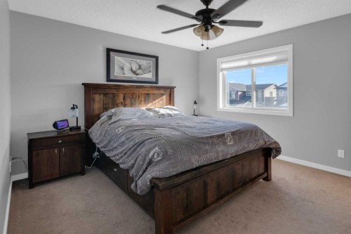 82 Fireside Cove, Cochrane, AB - Indoor Photo Showing Bedroom