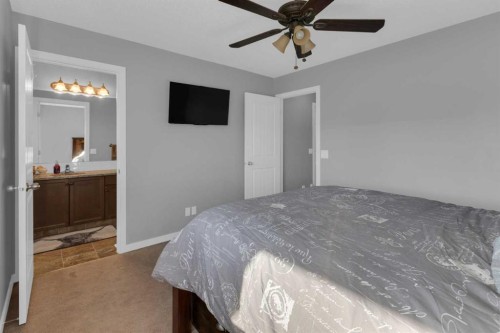 82 Fireside Cove, Cochrane, AB - Indoor Photo Showing Bedroom