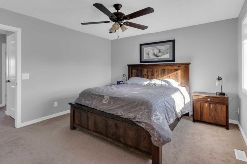 82 Fireside Cove, Cochrane, AB - Indoor Photo Showing Bedroom