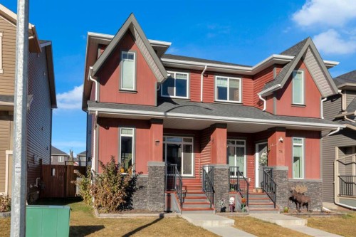 82 Fireside Cove, Cochrane, AB - Outdoor With Facade