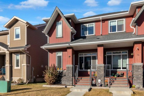 82 Fireside Cove, Cochrane, AB - Outdoor With Facade