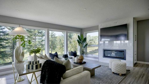 24073 Burma Road, Rural Rocky View County, AB - Indoor Photo Showing Living Room With Fireplace