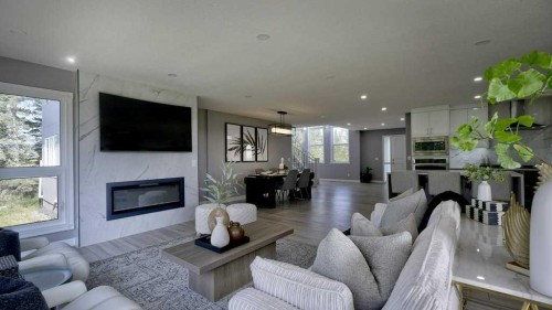 24073 Burma Road, Rural Rocky View County, AB - Indoor Photo Showing Living Room With Fireplace