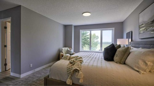 24073 Burma Road, Rural Rocky View County, AB - Indoor Photo Showing Bedroom