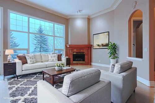 4536 Hamptons Way Nw, Calgary, AB - Indoor Photo Showing Living Room With Fireplace