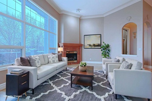 4536 Hamptons Way Nw, Calgary, AB - Indoor Photo Showing Living Room With Fireplace