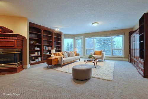 4536 Hamptons Way Nw, Calgary, AB - Indoor Photo Showing Living Room With Fireplace