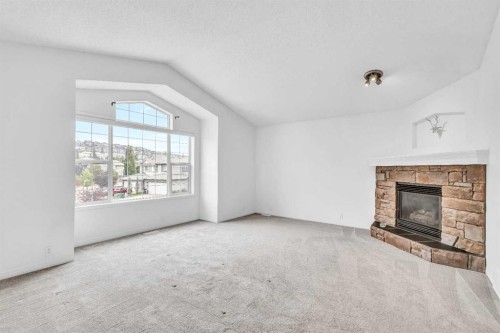 331 Springbank Place Sw, Calgary, AB - Indoor Photo Showing Living Room With Fireplace
