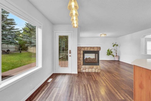 331 Springbank Place Sw, Calgary, AB - Indoor Photo Showing Other Room With Fireplace